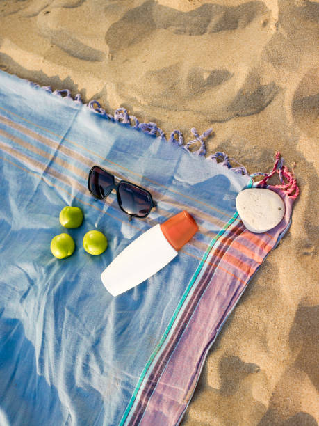 Beach towel and sun glasses