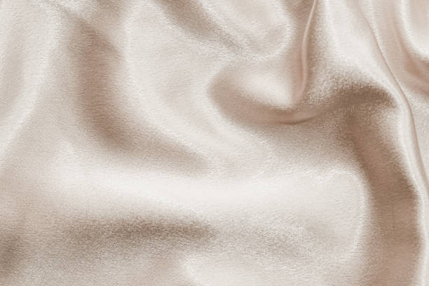 istock Beige silk fabric texture, Satin fashion Background for content. 1461441778
