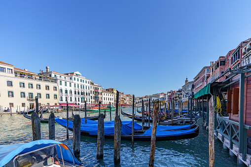 View of moored Venetian gondolas waiting for tourists