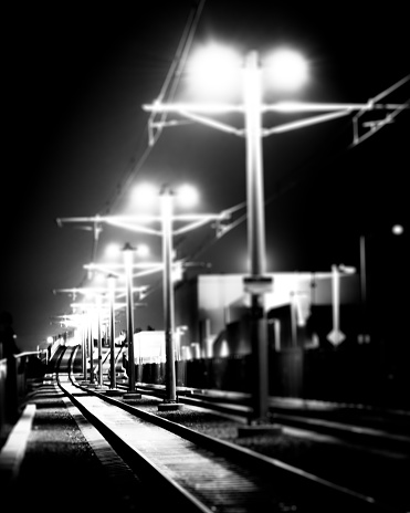 Railroad tangle at large train station. Railway transportation theme. Black and white image.