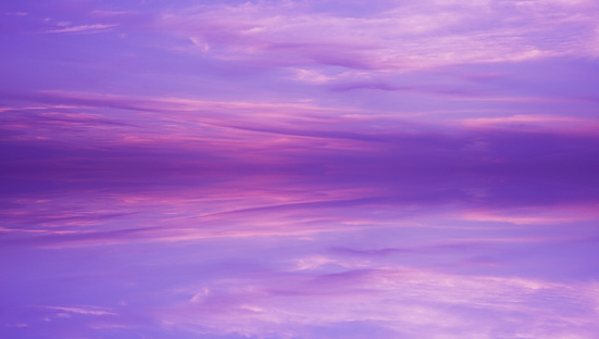 Light purple pink lilac orchid abstract background. Evening sky with clouds. Beautiful colorful sunset. Reflection. Elegant background for design. Romantic. Fantastic, fantasy, cute, magical.