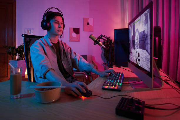 istock Videogamer Playing first Person Shooter 1461453086