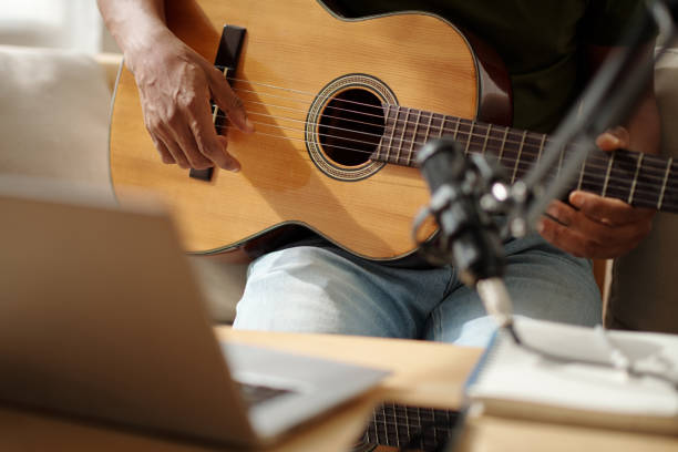istock Artist Recording Himself Playing Guitar 1461455089