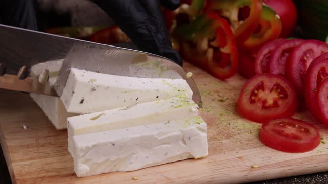 Slicing soft cream cheese for salads