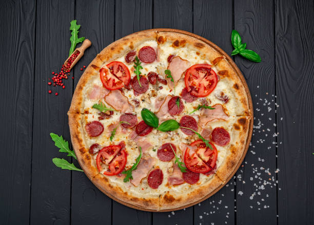 istock Pizza with mozzarella cheese, salami and chicken meat 1461457456