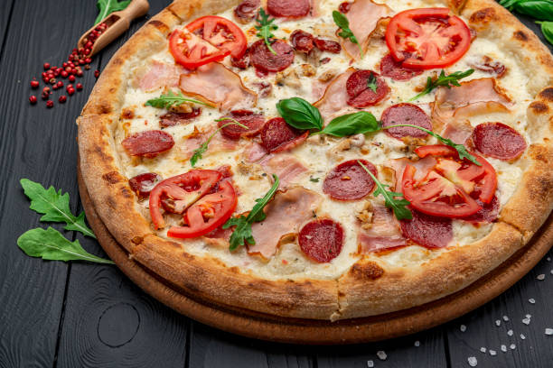 istock Pizza with mozzarella cheese, salami and chicken meat 1461457468