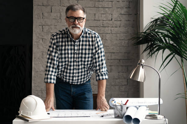 Portrait of architect looking at camera in office.