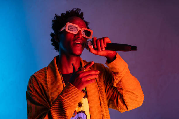 istock African American handsome young man singing into the microphone 1461458695