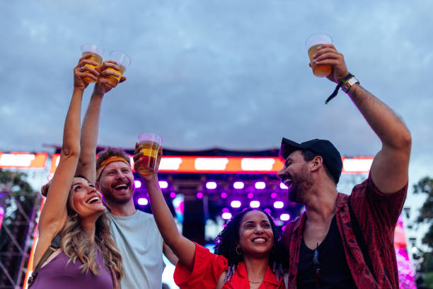 istock Excited friends cheering with beer at concert 1461463825