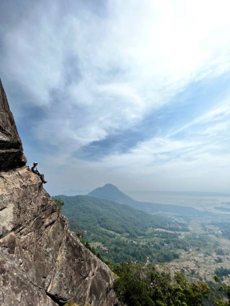 istock Man upon the rock mountain 1461464939