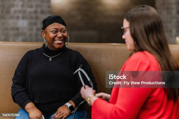 Senior Black Woman With Cancer At A Medical Appointment Stock Photo - Download Image Now