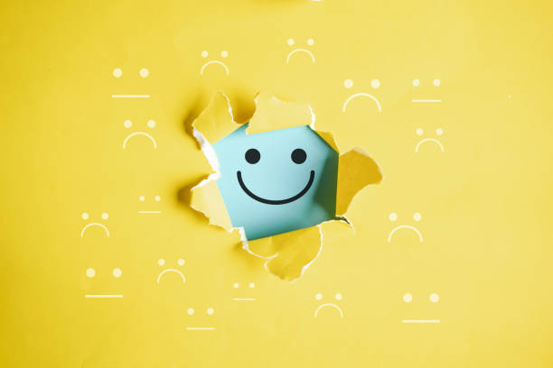 istock Happy Smile face inside among sad face positive mindset change bipolar, excellent evaluation concept , Customer experience and quality feedback concept. 1461480657