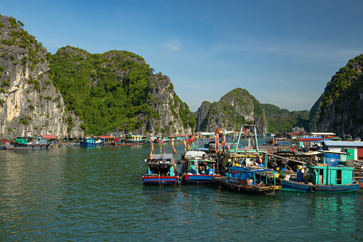 Cat Ba, Vietnam - November 20, 2022: Cai Beo fishing village in Lan Ha & Ha Long Bay as accessed via the tropical paradise of Cat Ba Island, Vietnam in southeast Asia.