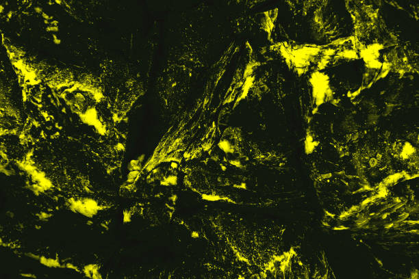 istock Grunge black yellow texture. Toned cracked stone surface. Dark  rough background with space for design. 1461491555