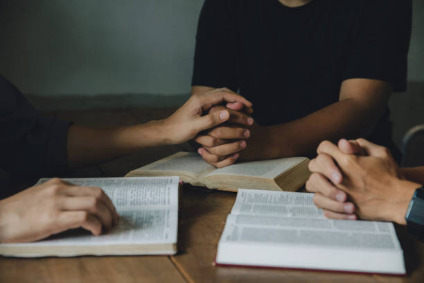 istock Christians and Bible study concept. Group of Christians holding 1461493551