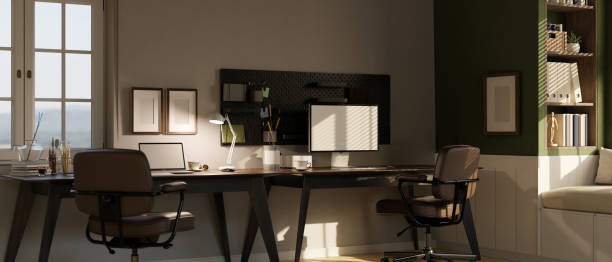 istock Scandinavian contemporary home working room with laptop and computer on working desk 1461498050