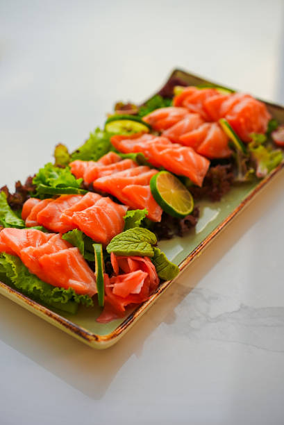 istock Salmon sashimi with dipping sauce and vegetable 1461499554