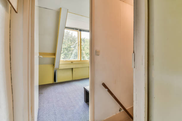 istock Narrow corridor with doors and lamp 1461499584