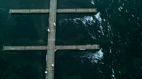An aerial shot of docks Frozen in the icy water on the shores of Lake Ontario in the winter
