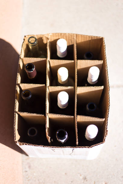 istock Empty Wine Bottles in Box, Sunlit Overhead Shot 1461509284