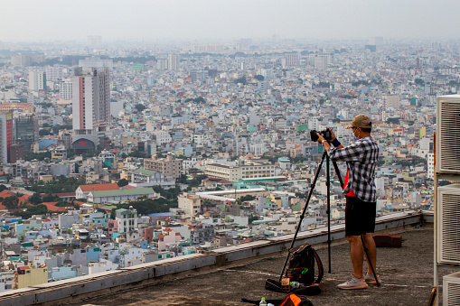 Ho Chi Minh City, Vietnam - ‎‎‎‎August 28, 2020 : A Photographer Taking Picture On Top Of A Building In Ho Chi Minh City