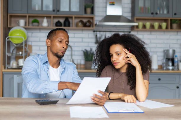 istock A couple sitting together and going through their finances at home 1461510807