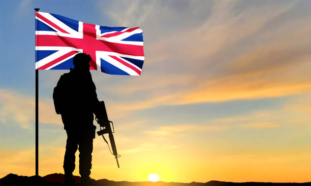 istock Silhouette of soldier with United Kingdom flag 1461515306