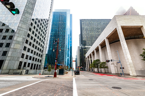 A street through the heart of downtown Houston, Texas on a cloudy winter morning.