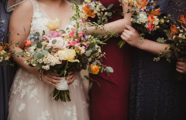 istock Bride and bridesmaids with bouquets 1461519166