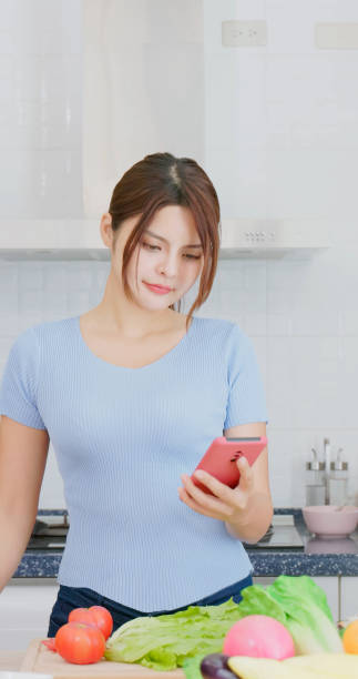 istock Asian girl cooking 1461524786