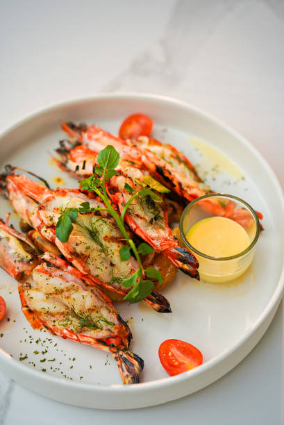 istock Grilled shrimp and sauce in a white plate 1461530054