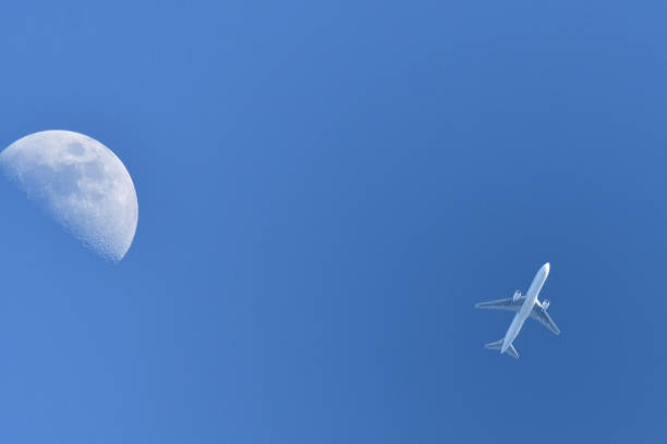 istock Jetliner flying near the moon. 1461531267