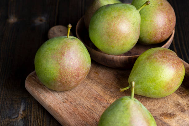istock Whole ripe green pears on the board 1461534835