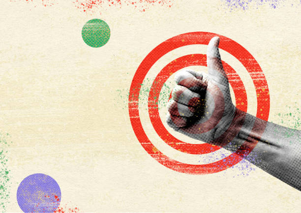 Hand and thumbs up like against the background of the target. stock photo
