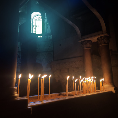 A votive candle in The Church of the Holy Sepulcher in the Christian Quarter of the Old City of Jerusalem