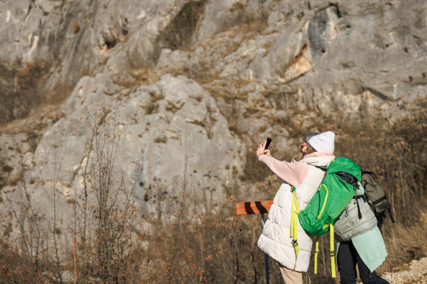 istock Mother and daughter taking selfie while hiking in rocky mountain 1461547024
