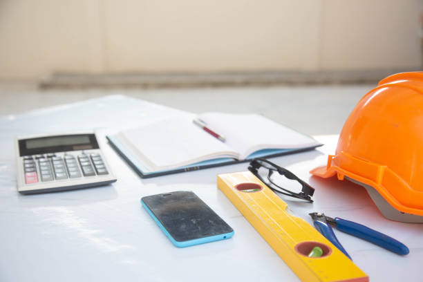 istock Desk of Architectural working project in construction site 1461554104