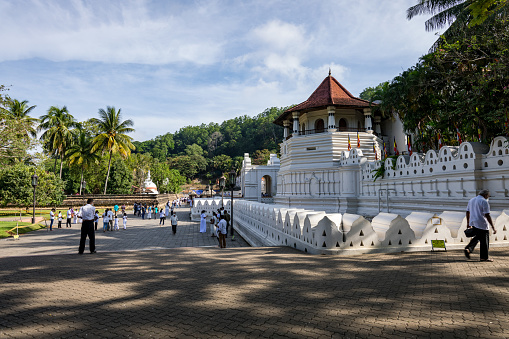 Kandy, Sri Lanka - March 03:, 2022: Temple of the Tooth Relic, famous temple housing tooth relic of the Buddha, UNESCO World Heritage Site, Kandy, Sri Lanka, Asia.