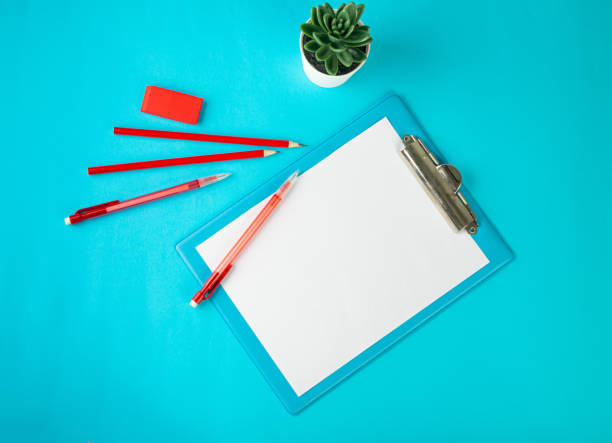 istock Blank Paper Tablet Top View, Empty White Sheet on Blue Table Flat Lay Mockup, Paper Tablet Texture Background 1461554311