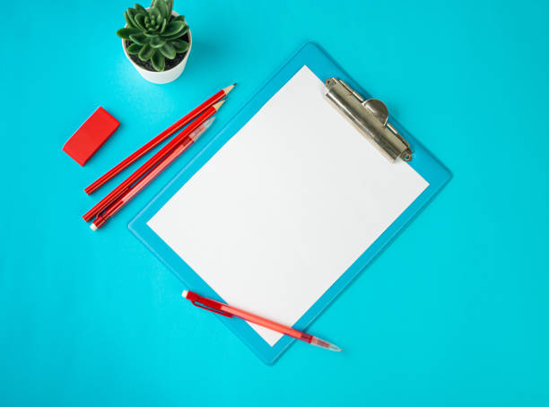 istock Blank Paper Tablet Top View, Empty White Sheet on Blue Table Flat Lay Mockup, Paper Tablet Texture Background 1461554315
