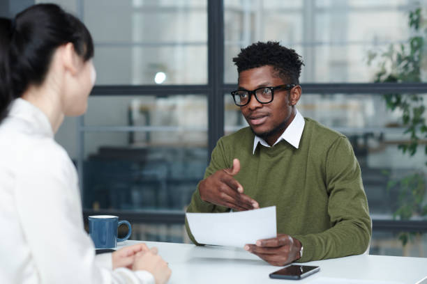 istock Businessman discussing resume with candidate 1461554394