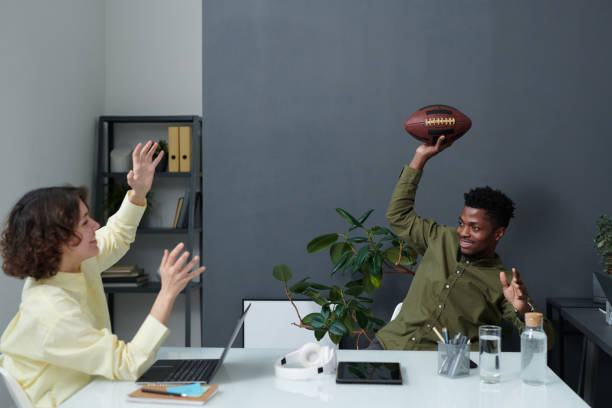 istock Business people playing rugby in office 1461556658