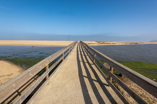 Wooden boardwalk at Praia Foz do Sizandro,