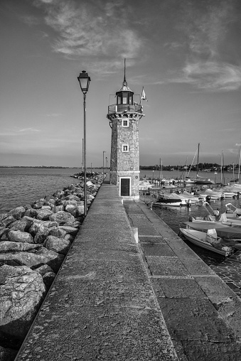 Black and white image of the lighthouse in Desenzano del Garda , lake Garda, Italy.