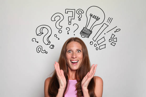istock Surprised mature brunette woman with question marks above her head. Idea, brainstorming, thinking concept 1461558837