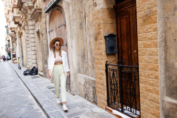 istock Happy woman walking in old Mediterranean town 1461560231