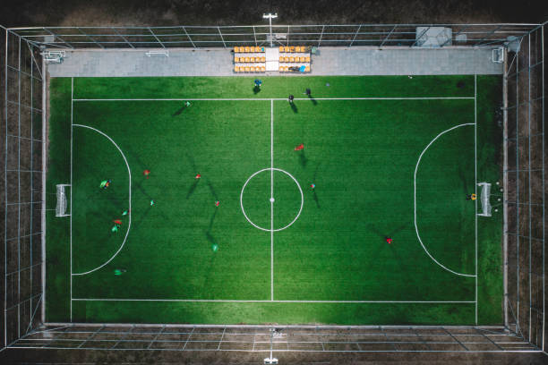 istock Small football pitch with some players 1461561640