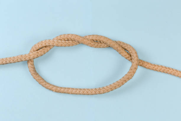 istock Rope knot Double overhand knot on a blue background 1461562330