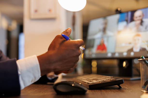 istock Businessman discussing financial statistics with remote team 1461562794