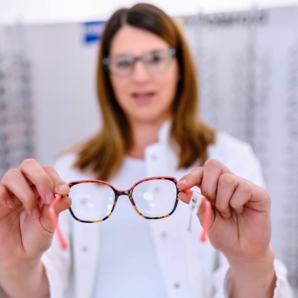 Optometrist suggesting glasses stock photo